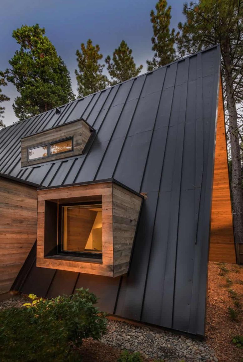 On this side there’s also a set of small windows that protrude from the roof, adding depth to the design On this side there’s also a set of small windows that protrude from the roof, adding depth to the design