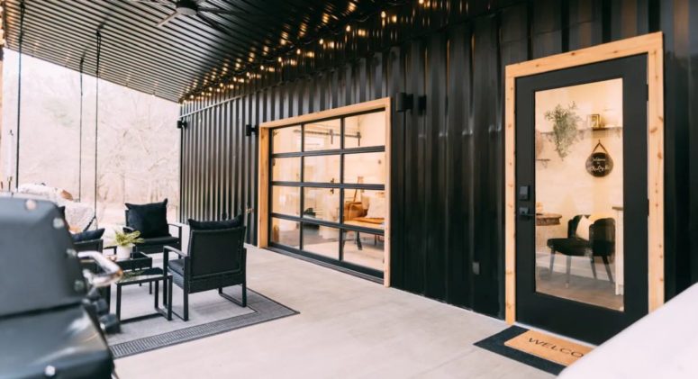 The porch and the indoor living area are separated by a glass garage door