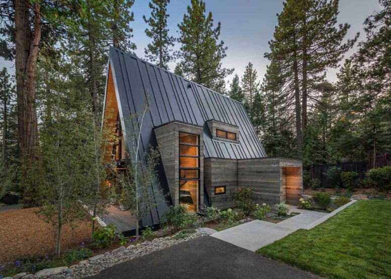 The entrance facade has a very inviting design, reminiscent of rustic mountain cabins