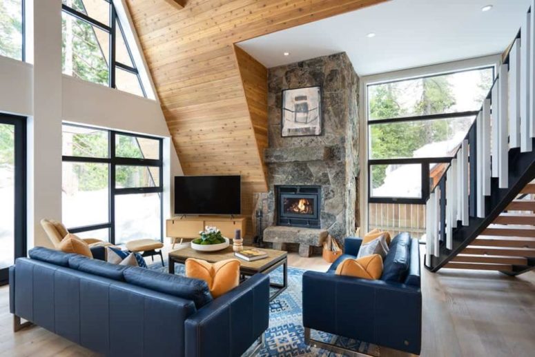Another rustic reference is the stone fireplace which is present in the main living area
