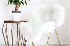 21 an IKEA Snille chair hack with gold spray paint and faux fur results is a very glam piece