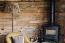 22 a vintage meets rustic reading nook with a wood burning stove, vintage furniture and reclaimed wood walls