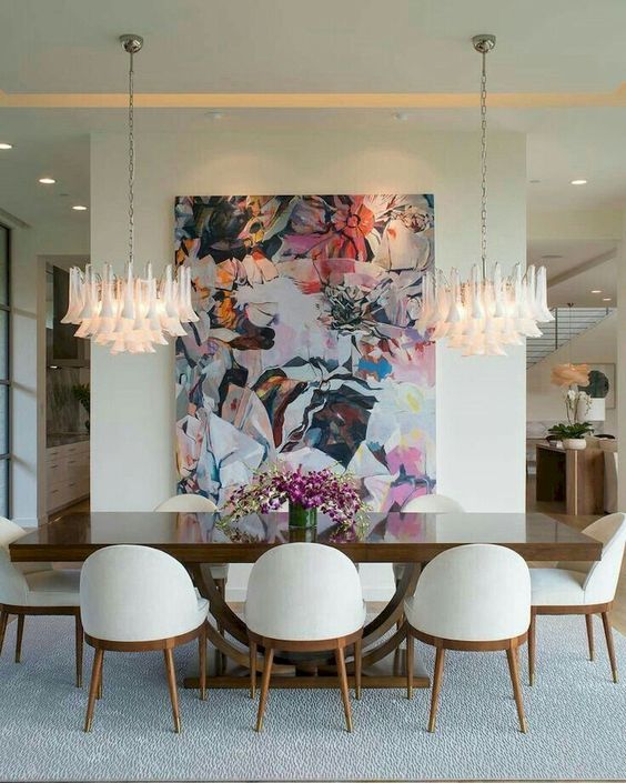 lots of rectangles softened with rounded white chairs make dining space balanced and very refined