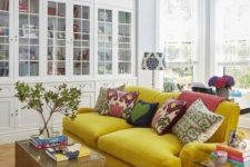 31 a bold mustard velvet sofa is the main decor piece in this space, and it brings color to it