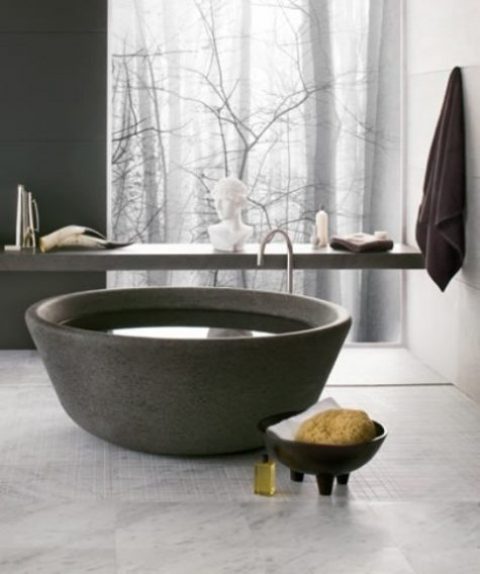 a unique bowl-like stone bathtub is an ultimate solution for a contemporary or minimalist bathroom