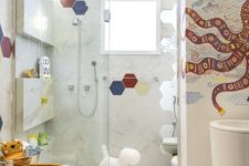 colorful hexagon tiles and a bright octopus mosaics on the wall, fun toys to make the bathroom cooler
