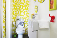 make a kids’ bathroom fun with bright and quirky wallpaper, rugs, accessories and shelves on the wall