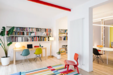 01 This apartment is styled as a contemporary fluid living space with ultra-bright colors in each room