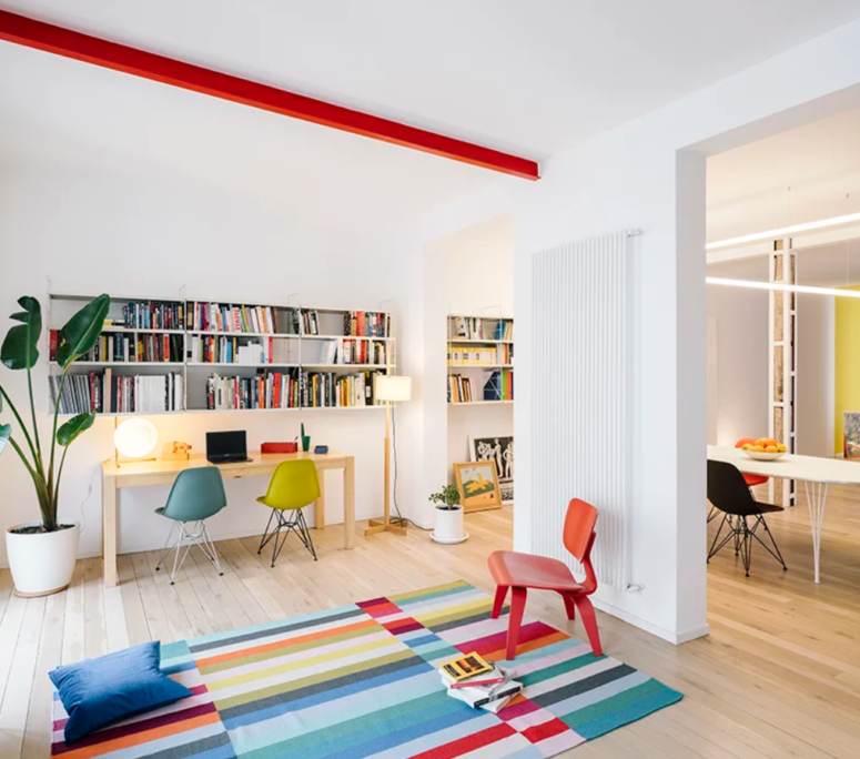 This apartment is styled as a contemporary fluid living space with ultra bright colors in each room