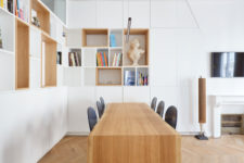 02 There are lots of storage units, open and closed sleek ones, and the dining table is a single and long slab of wood