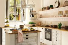 02 a beautiful white kitchen with a vintage-inspired whitewashed kitchen island for a trendy look