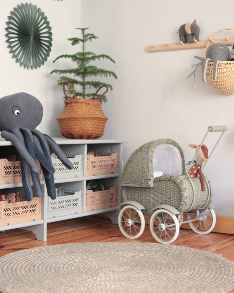 octopi incorporated into nursery decor as plush toys are a cool way to bring a bit of sea life to the space