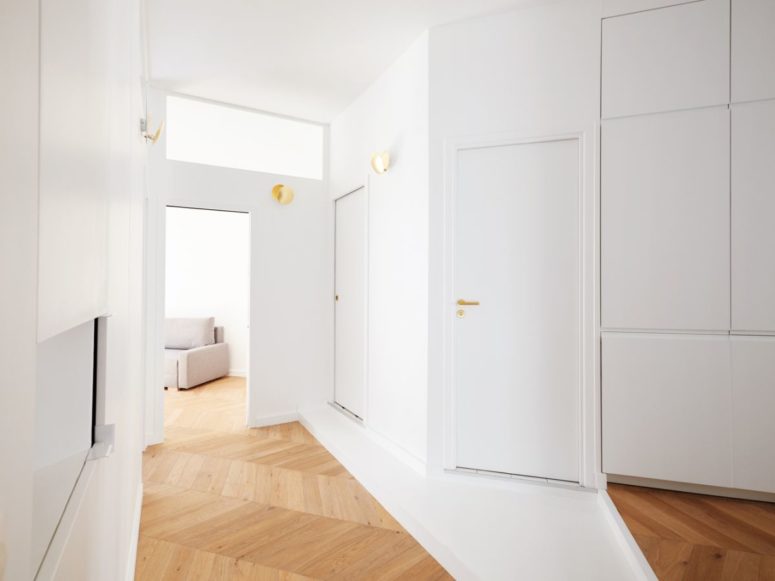Such built-in storage units are incorporated into the whole apartment to make stored things invisible