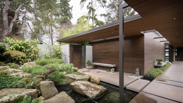 The outdoor spaces include a water body and rocks that are also traditional for Japanese gardens
