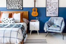 03 a small bedroom done with blueberry blue color blocking, graphic artworks and pritned textiles all over