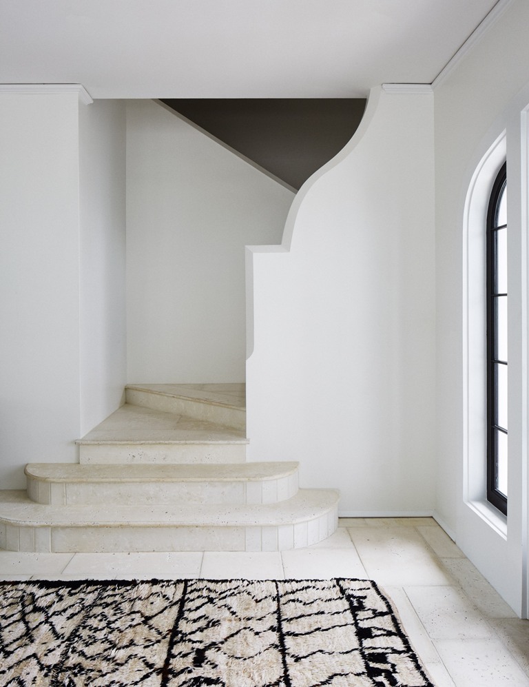 The same curved tiles and white concrete can be seen indoors, and neutral tiles add an outdoor feel here The same curved tiles and white concrete can be seen indoors, and neutral tiles add an outdoor feel here