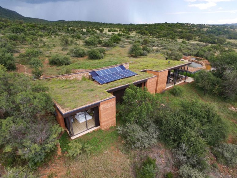 There are photovoltaic panels on the roof and they provide the house with some energy