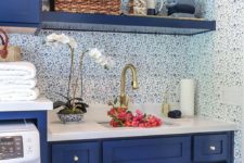 04 a tiny kitchen done with blueberry blue cabinets, shelves and white to maximize