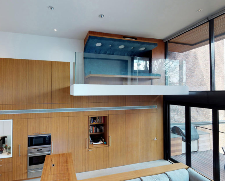 a small indoor balcony with a comfy seating