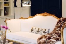 05 a contrasting contemporary space finished off with a beautiful vintage white sofa with gilded framing
