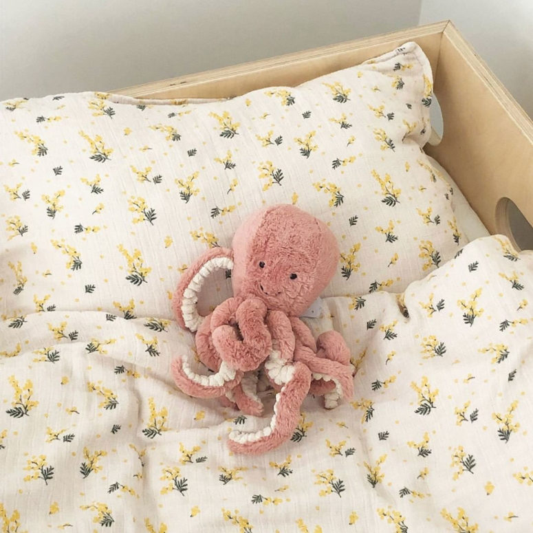 put a cute plush toy on the kid's bed to make the dreams sweeter than usual