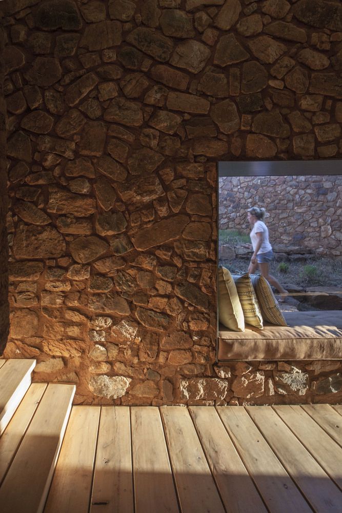 The walls were done thick to regulate the temperature inside the house throughout the year