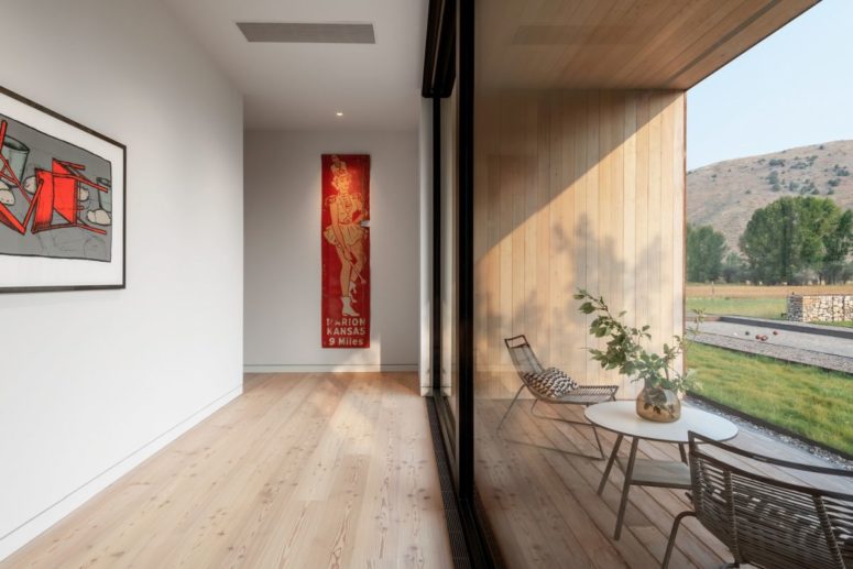 Large windows bring in lots of light and also expose the internal spaces to the panoramic views