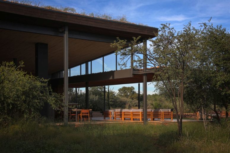 There's a large terrace with contemporary furniture here and the house can be opened to outdoors anytime
