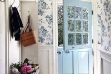 08 a vintage-inspired entryway with blue floral wallpaper and elegant wainscoting looks very chic and inviting