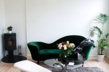 10 a vintage dark green velvet sofa and a medallion on the ceiling to add a chic look to the space