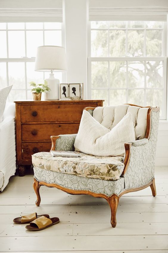 refresh your neutral farmhouse space with a refined vintage chair to make it more elegant and stylish