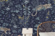trendy nursery decor with a floral wallpaper