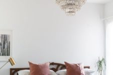 19 a modern boho bedroom in neutrals and pastels with a statement vintage crystal chandelier over the bed
