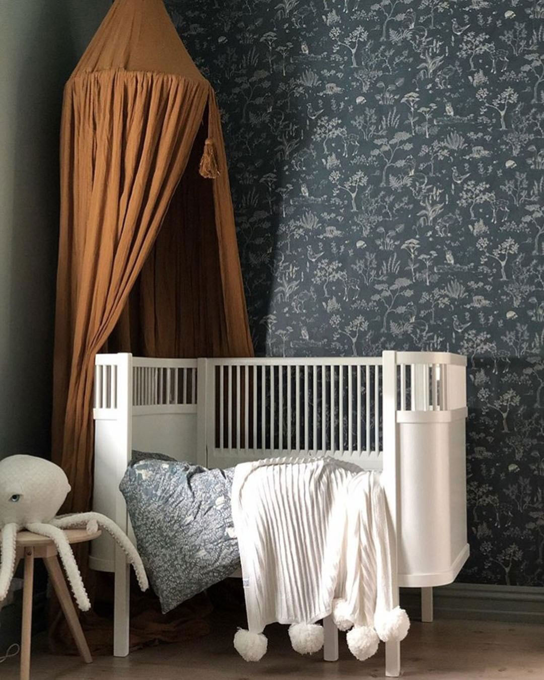 dark botanical print wallpaper is another cool idea to rock dark shades in the nursery