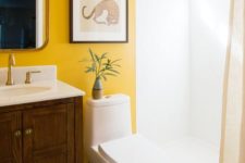23 make your monochromatic bathroom unique and bold with a statement marigold wall