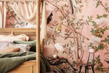 23 pink flora and fauna wallpaper creates a warm ambience in the bedroom and takes over the whole space