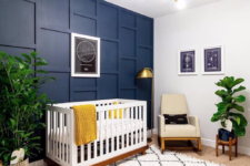 24 a chic nursery with a navy 3D wall and a navy planter to spice up the neutral space and makes it cooler