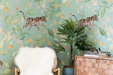 24 a whimsical space with unique floral and fauna wallpaper that gives a bold tropical feel to the space