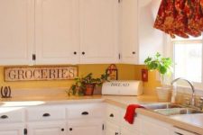a vintage kitchen in white, a yellow kitchen backsplash and vintage touches plus bright shades for a bolder look