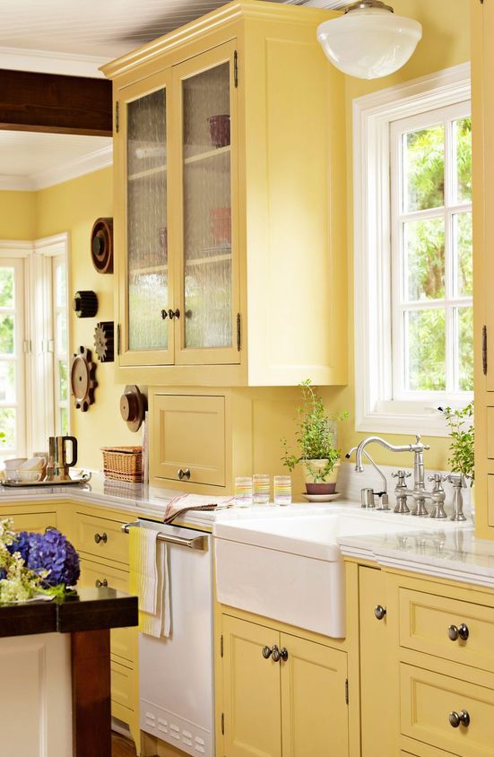 a vintage yellow kitchen with refreshing white accents and dark stained touches is a bold idea with a chic feel