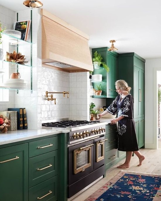 an emerald shaker style kitchen with white countertops, a wooden hood and a white square tile backsplash is amazing