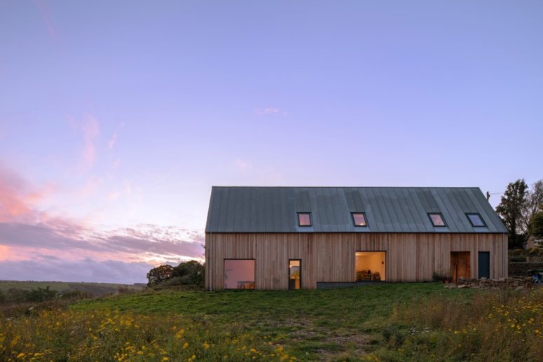 The house is clad with Douglas fir and a zinc roof, there are lots of windows and skylights