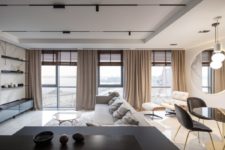 02 The main space is an open layout with a kitchen, dining and living room plus a window wall to have cool views and much light