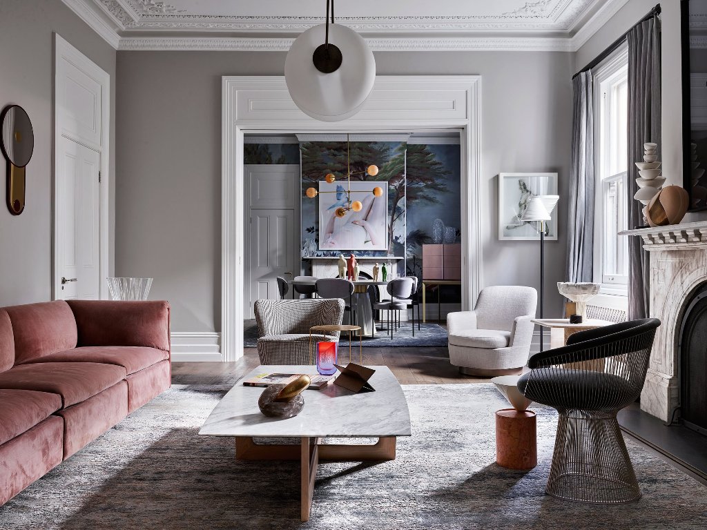 The muted color palette is spruced up with bold artworks, lamps and accessories