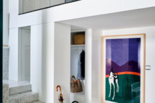02 These are two apartments merged into one, filled with natural light and with bold artworks and trendy furniture