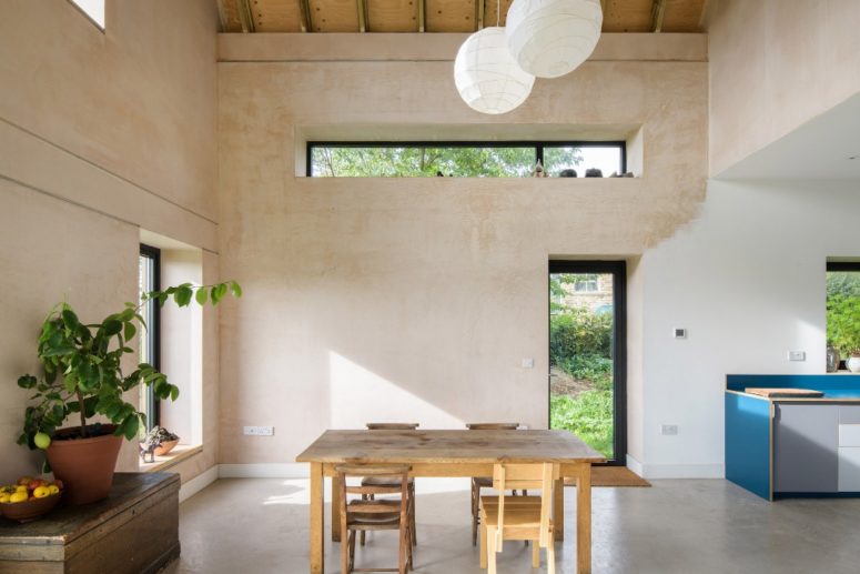 You can alo see brown plaster that was used to warm up the space, and lots of natural light floods the spaces