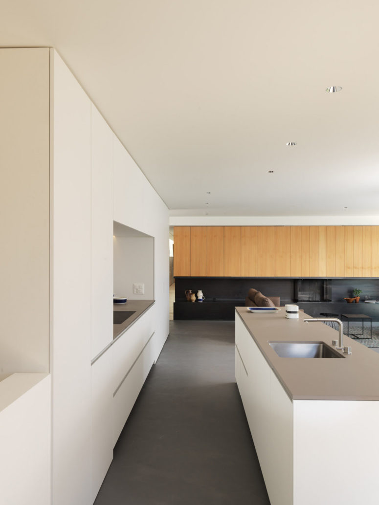The color scheme is neutral - grey and white, with addition of black for drama and light-colored natural wood for a soft touch