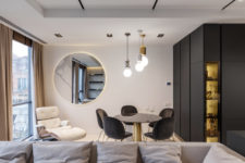 05 The dining zone features also a cool white lounger and creative pendant lamps that look like bulbs