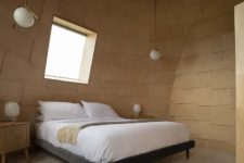 06 The master bedroom is also covered with bent plywood and the furniture is simple