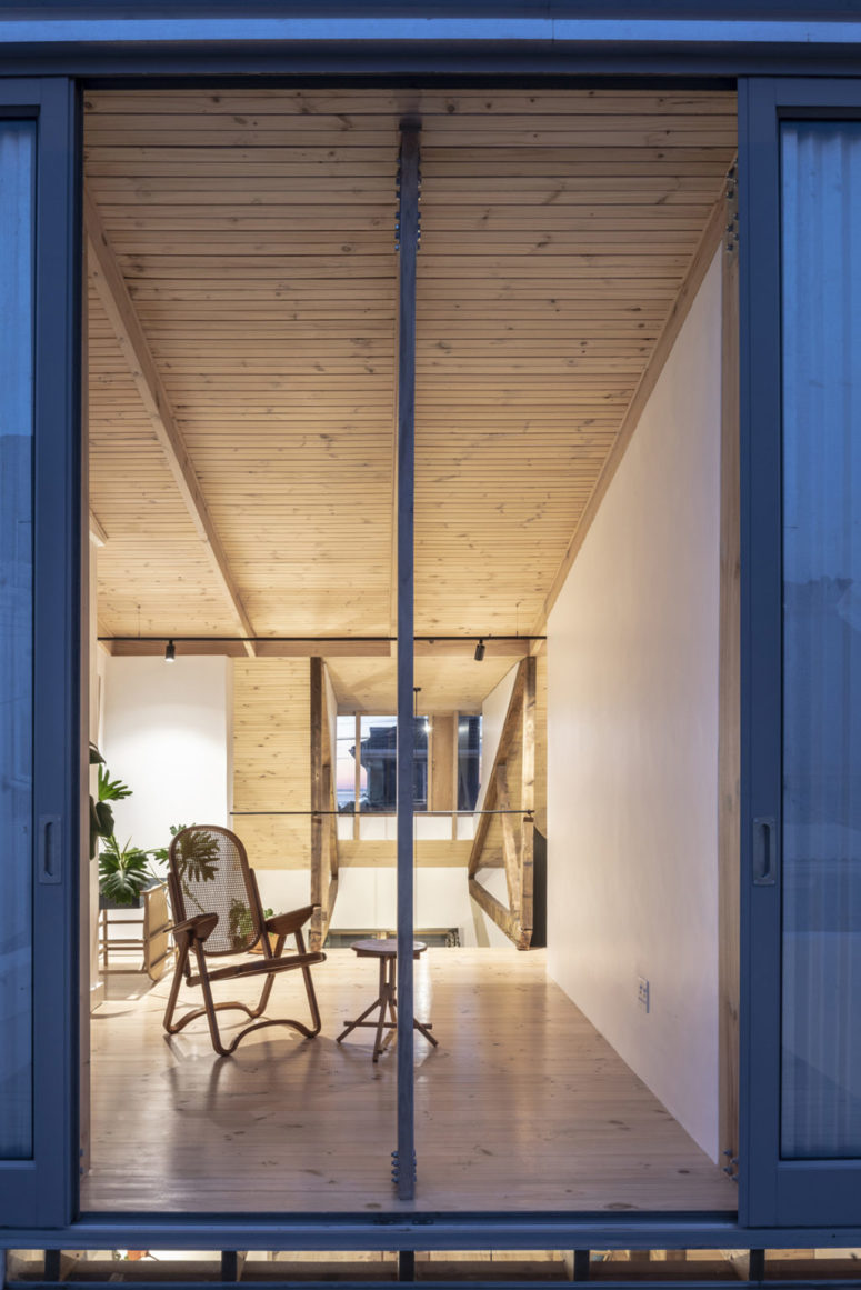 wooden nook is perfect for a reading nook This is a reading nook with chic vintage wooden furniture by a large window to enjoy the views